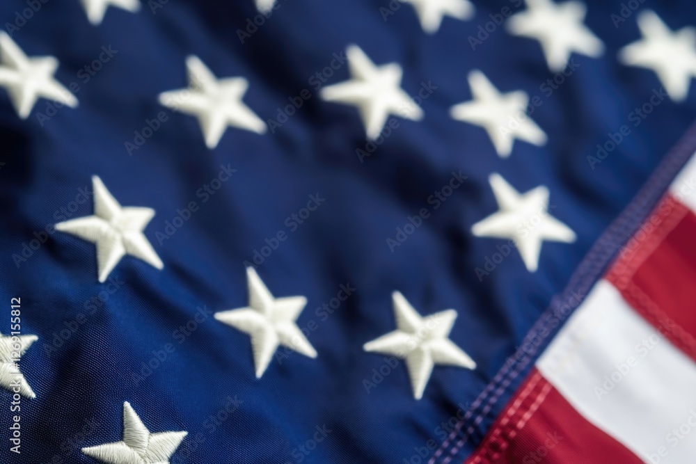 Fototapeta premium Close-up image of the American flag featuring white stars on a blue background