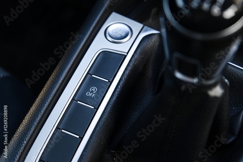 Close-up of car automatic start/stop system button