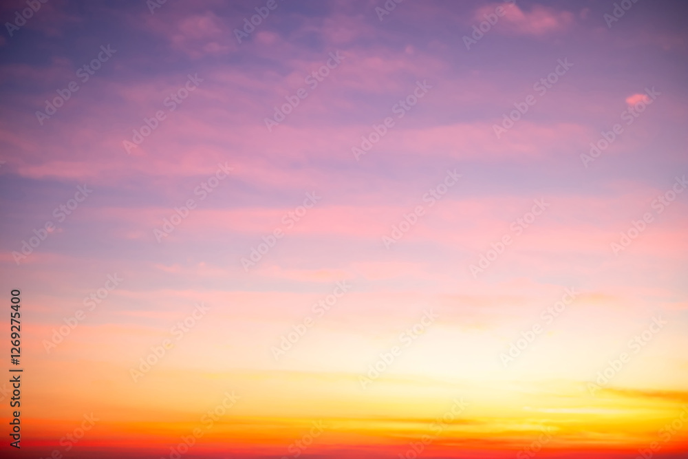 Fototapeta premium Beautiful , luxury soft gradient orange gold clouds and sunlight on the blue sky perfect for the background, take in evening,Twilight, Large size, high definition landscape photo