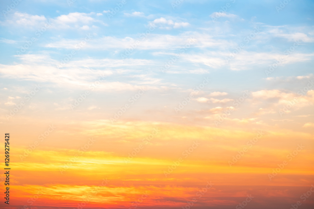 Fototapeta premium Beautiful , luxury soft gradient orange gold clouds and sunlight on the blue sky perfect for the background, take in evening,Twilight, Large size, high definition landscape photo