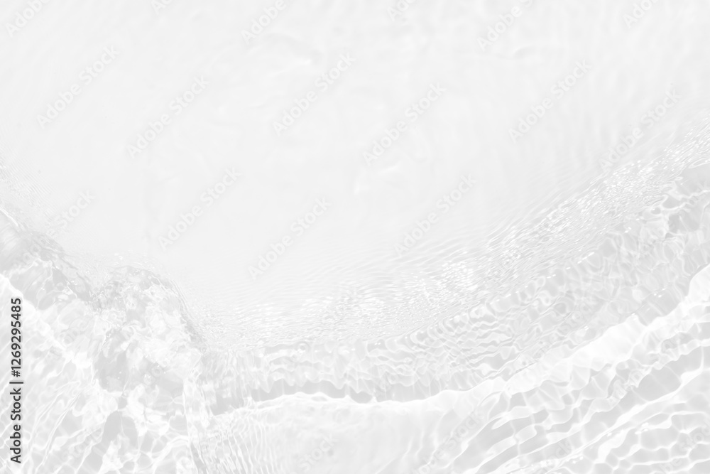 Obraz premium White water with ripples on the surface. Defocus blurred transparent white colored clear calm water surface texture with splashes and bubbles. Water waves with shining pattern texture background.
