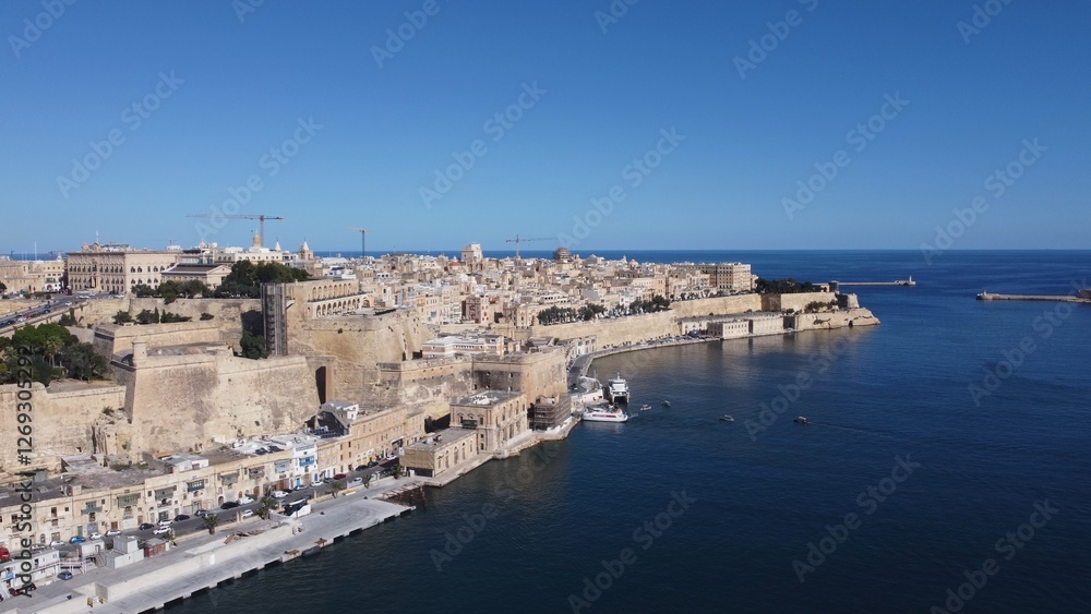 Valletta waterfront, Malta, aerial view. Valetta on the left and three cities on the right. High quality photo Valletta waterfront, Malta, aerial view. Valetta on the left and three cities on the right. High quality photo