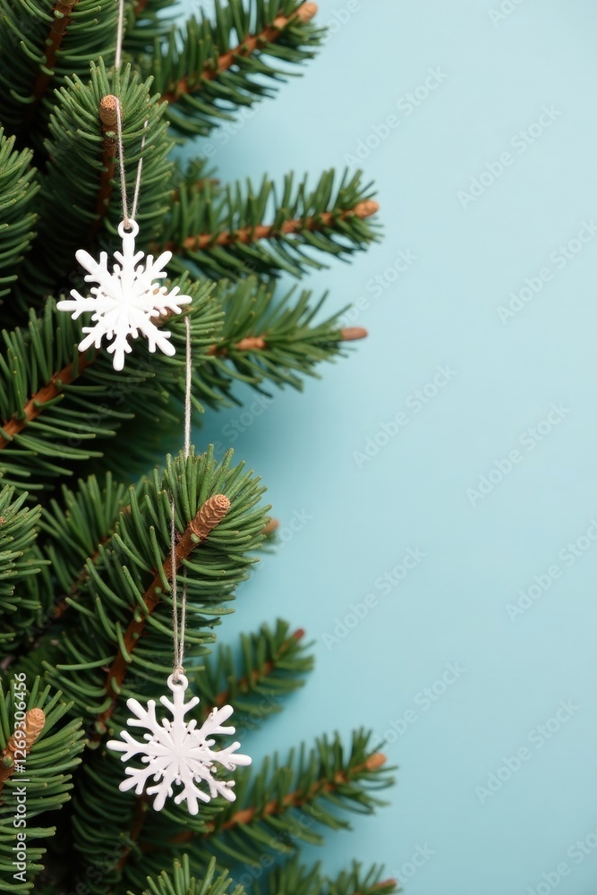 Decorated garland on a plain evergreen branch, snowflake decorations, simple christmas decor, decorated garland Decorated garland on a plain evergreen branch, snowflake decorations, simple christmas decor, decorated garland