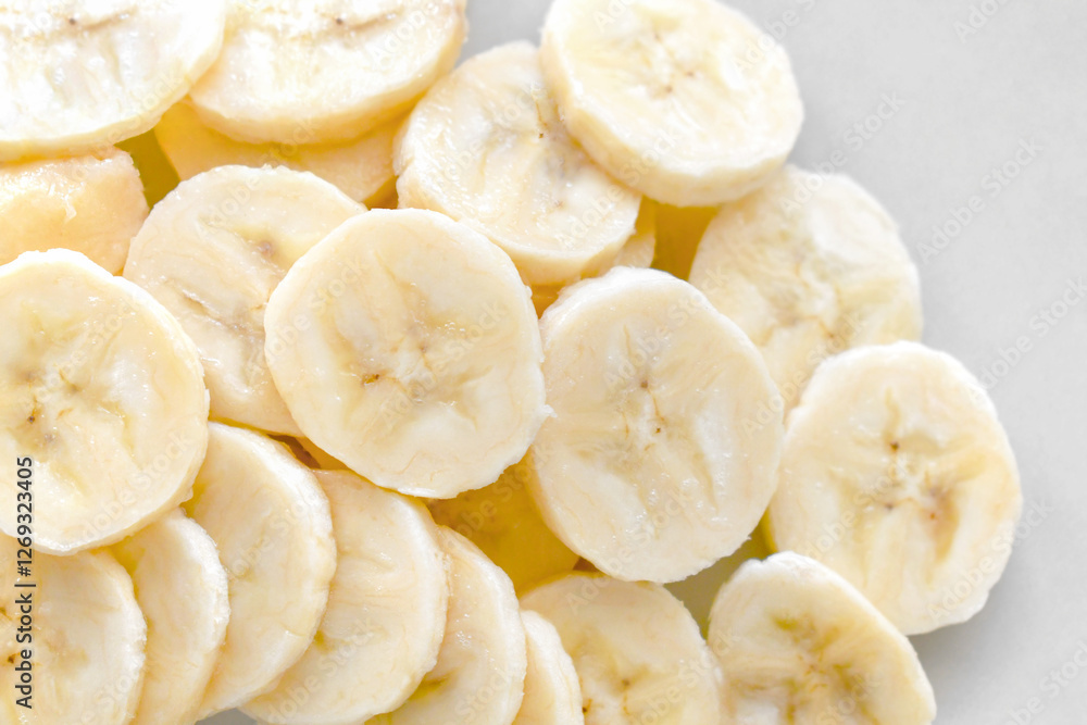 Banana slices on a plate. Healthy and dietary food. Banana slices on a plate. Healthy and dietary food.
