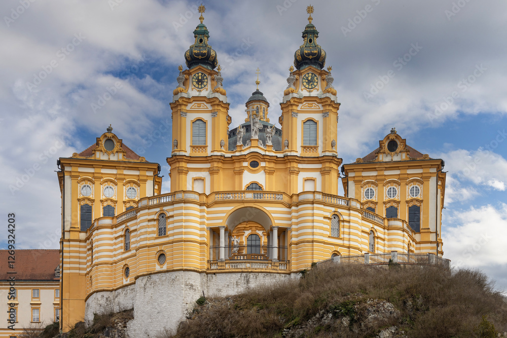 Melk, Austria - February 24, 2023: View of Melk Abbey with Collegiate Church towers on background of blue sky. It was founded in 11th century, today's baroque abbey was built in 18th century