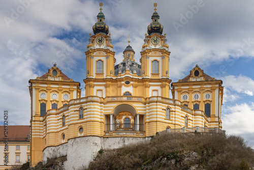 Obraz na płótnie Melk, Austria - February 24, 2023: View of Melk Abbey with Collegiate Church towers on background of blue sky. It was founded in 11th century, today's baroque abbey was built in 18th century w salonie