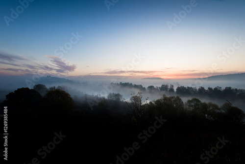 Benedictine abbey in Tyniec, foggy autumn sunrise. A monastery is located close to Kraków, Poland.