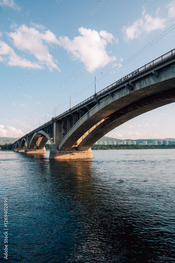 Communal bridge over the Yenisei River at beauty sunny summer day in Krasnoyarsk city. Communal bridge over the Yenisei River at beauty sunny summer day in Krasnoyarsk city.