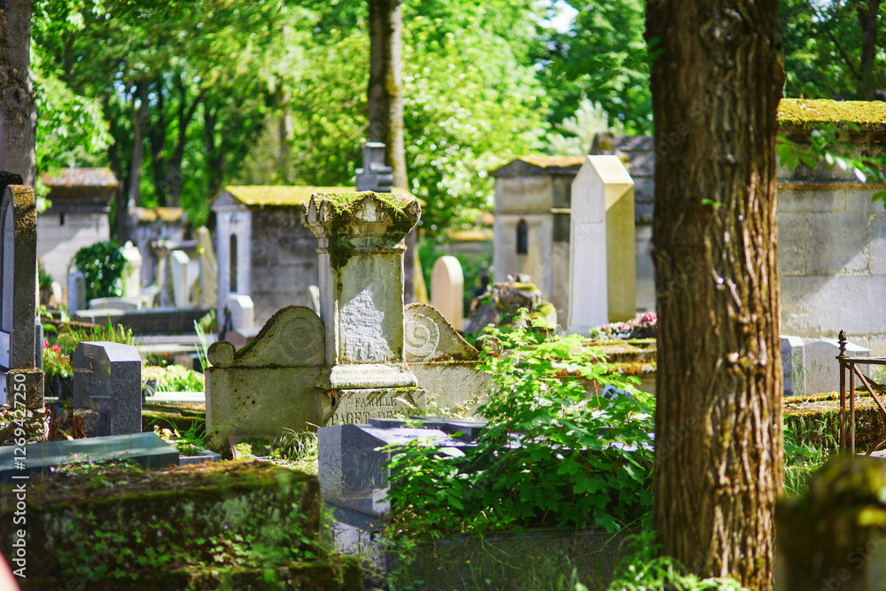 Gravestones at Pere-Lachaise cemetery in Paris, France. Gravestones at Pere-Lachaise cemetery in Paris, France.