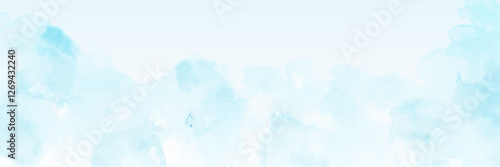 clear blue sky with a few clouds. The sky is very bright and the clouds are scattered throughout