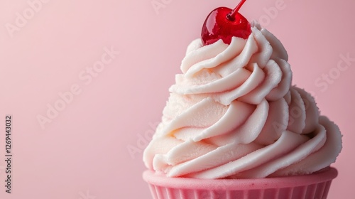 Delicious pink ice cream topped with a cherry against a soft pink background