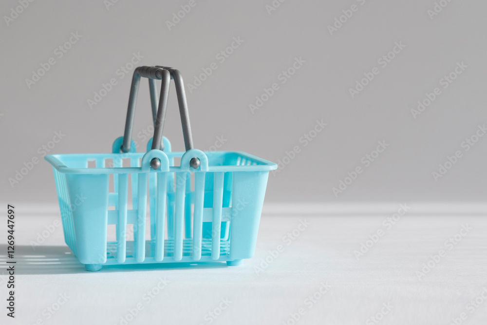 Fototapeta premium Blue shopping basket for shopping in the supermarket.