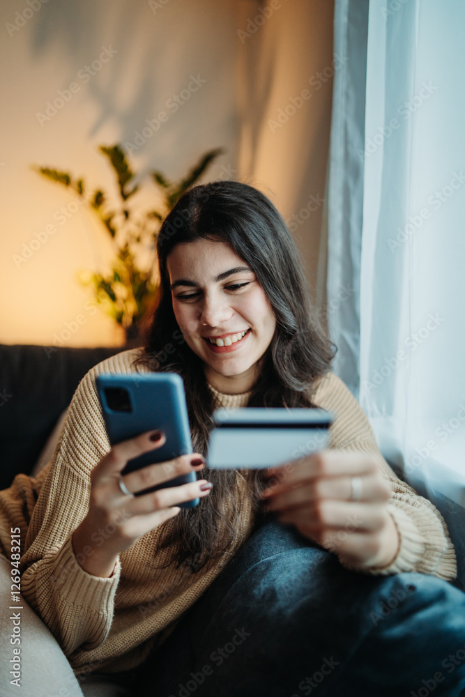 Young caucasian woman buy or pay online on smart phone using credit card
Young caucasian woman buy or pay online on smart phone using credit card