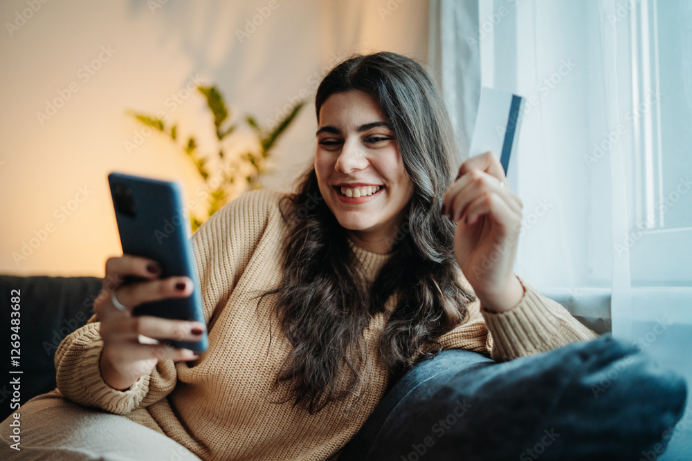 Young caucasian woman buy or pay online on smart phone using credit card
Young caucasian woman buy or pay online on smart phone using credit card