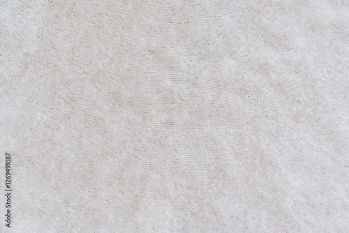 Close-up of soft white mohair fabric with delicate fibers and fluffy textured