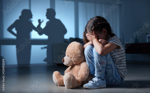 Frustrated little girl holding hands on ears, feels upset while angry parents fighting at background. parents fighting or conflict, divorce separation, arguing family problems, negative child impact.