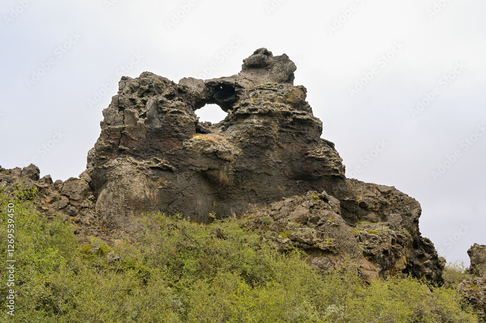 Lava formation in a nature reserve which is a tourist attraction in Dimmuborgir, Iceland. No people. Lava formation in a nature reserve which is a tourist attraction in Dimmuborgir, Iceland. No people.