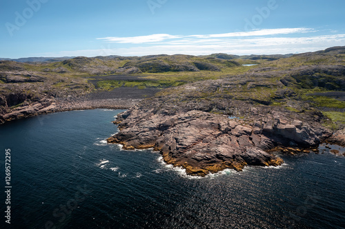 top view of the coast of the Barents Sea near the village of Teriberka on a clear summer day