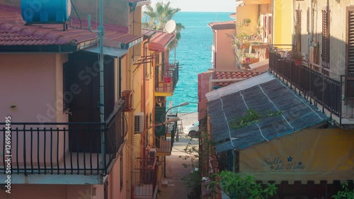 city ​​beach of italian city scilla, city fountain on the beach by the blue sea, resort
