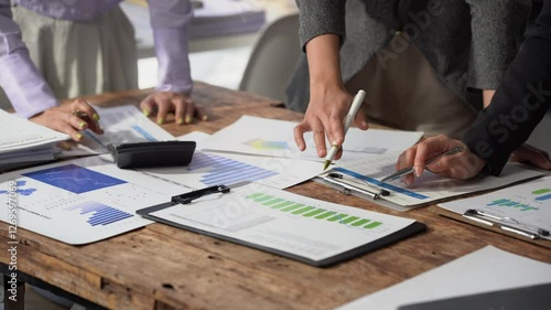 Small group of businessmen starting company, planning creative meeting using digital tablet showing financial data and graphs and laptop, financial analysis.