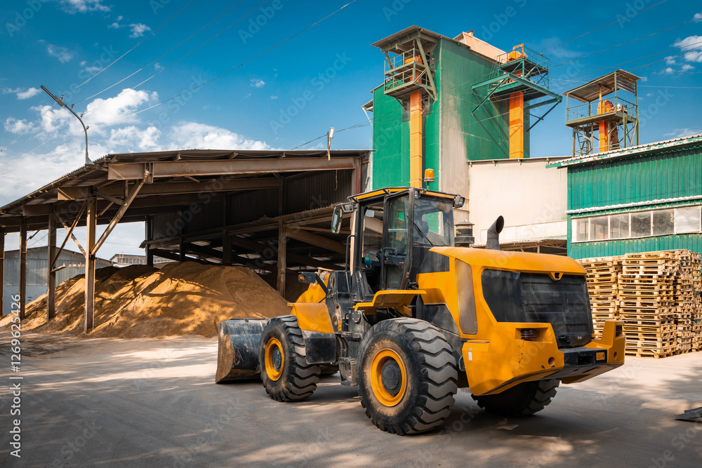 Obraz premium Gypsum factory sand storage and bulldozer