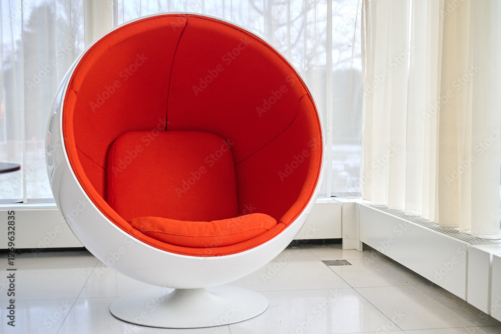 Style Space Age Ball Chair against clear windows