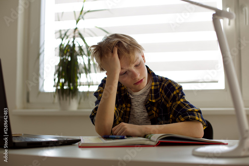 Tired Boy Doing Homework at a Desk