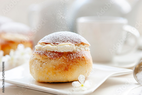 Homemade Semla or semlor, vastlakukkel, laskiaispulla - traditional Scandinavian sweet bun especially Fastelavn Shrove Monday and Shrove Tuesday. photo