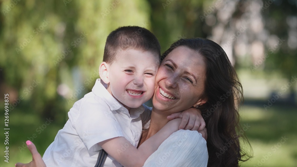 A heartwarming and joyful moment capturing a mother and her child as they share delightful times outdoors A heartwarming and joyful moment capturing a mother and her child as they share delightful times outdoors