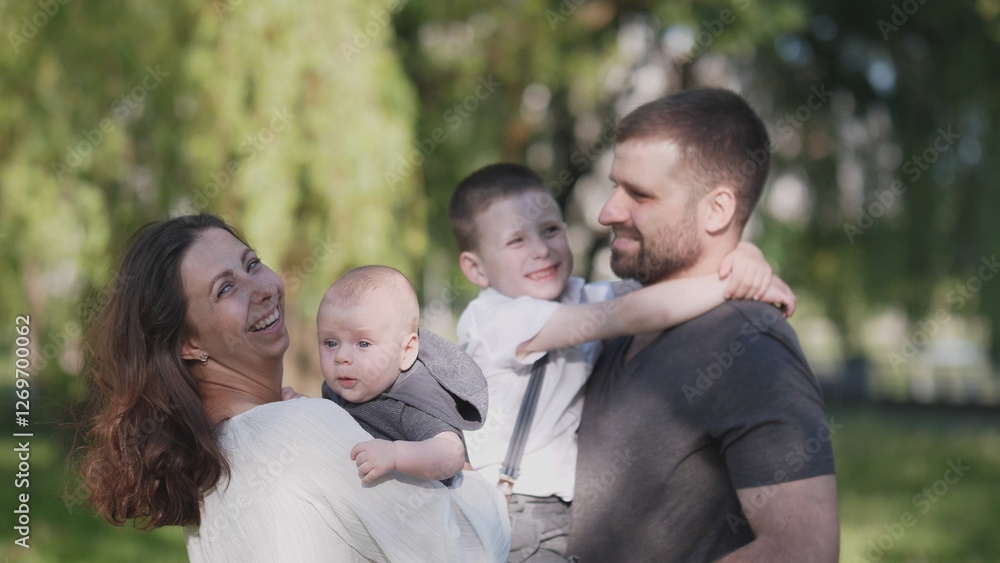 A joyful family is enjoying quality time spent outdoors, capturing moments of love and connection among them A joyful family is enjoying quality time spent outdoors, capturing moments of love and connection among them