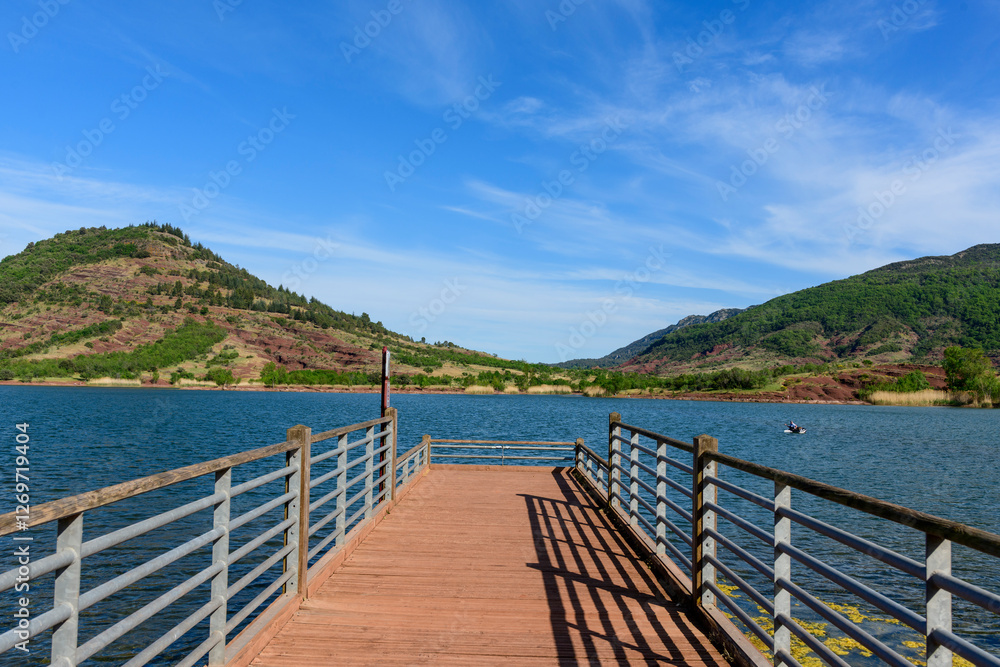 The pontoon of Lake Salagou in Europe, France, Occitanie, Herault, Clermont l Herault, in summer, on a sunny day. The pontoon of Lake Salagou in Europe, France, Occitanie, Herault, Clermont l Herault, in summer, on a sunny day.