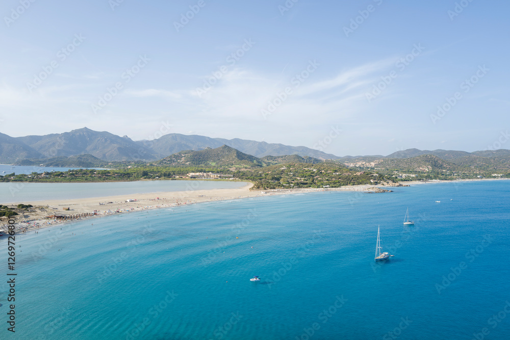 The beach of Porto Giunco in Europe, Italy, Sardinia, Cala Caterina, in summer, on a sunny day. The beach of Porto Giunco in Europe, Italy, Sardinia, Cala Caterina, in summer, on a sunny day.