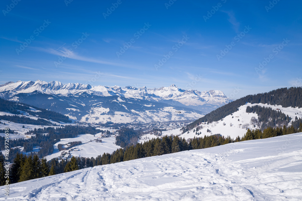 Fototapeta premium The view of Megeve and its countryside in Europe, France, Auvergne Rhone Alpes, Haute Savoie, Megeve, in summer, on a sunny day.