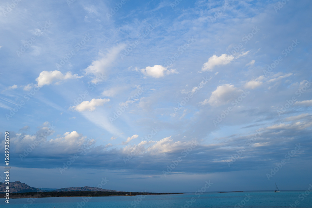 Isola Piana seen from La Pelosa beach at sunset in Stintino in Europe, Italy, Sardinia, Stintino, in summer, on a sunny day. Isola Piana seen from La Pelosa beach at sunset in Stintino in Europe, Italy, Sardinia, Stintino, in summer, on a sunny day.