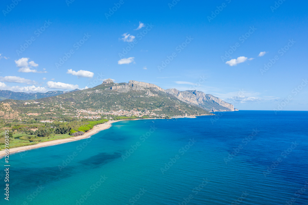 Obraz premium The sandy beach in Lotzorai in Europe, Italy, Sardinia, Lotzorai, in summer, on a sunny day.