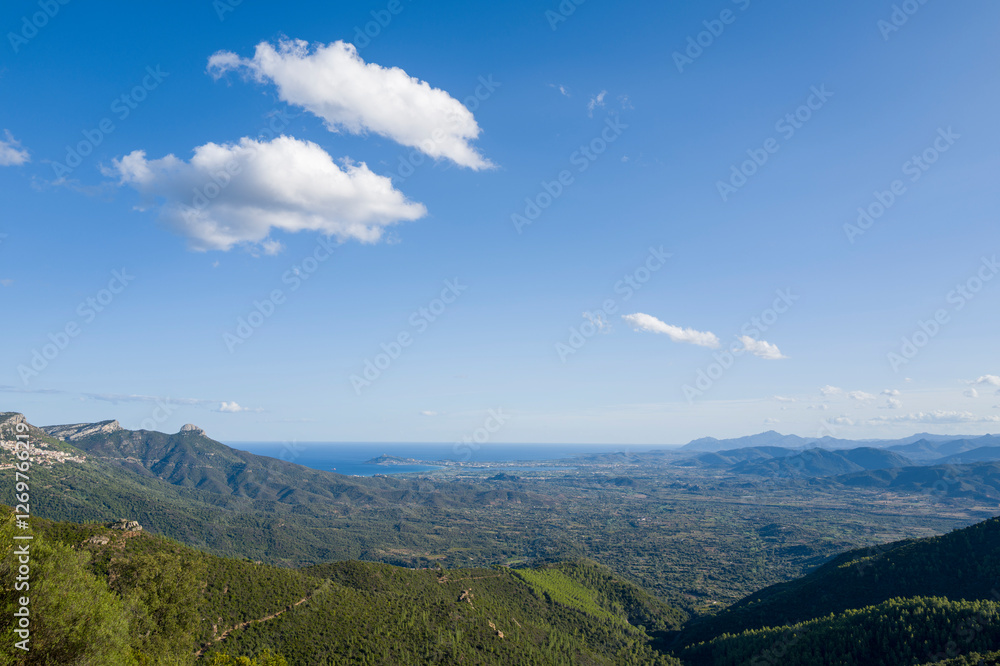 Naklejka premium The mountain and the sea between Baunei and Dorgali in Europe, Italy, Sardinia, Baunei, in summer, on a sunny day.