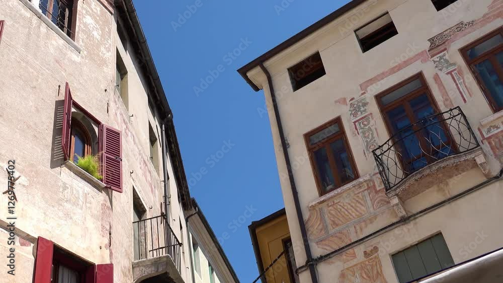 Municipality of Bassano del Grappa with flags and clocks on the wall on Freedom Square, Vicenza province of region of Veneto, in northern Italy. Municipality of Bassano del Grappa with flags and clocks on the wall on Freedom Square, Vicenza province of region of Veneto, in northern Italy.