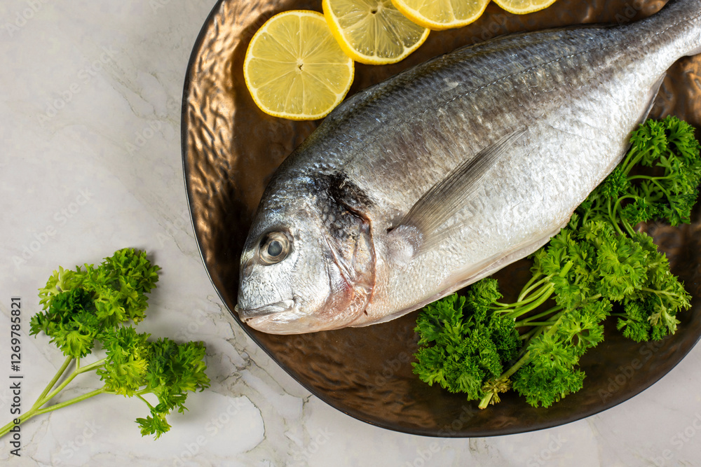 sea bream fish with lemon slices sea bream fish with lemon slices