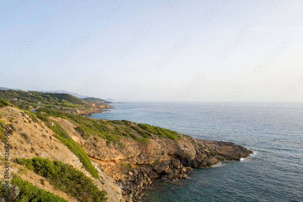 The coast between Alghero and Bosa in Europe, Italy, Sardinia, in summer, on a sunny day. The coast between Alghero and Bosa in Europe, Italy, Sardinia, in summer, on a sunny day.
