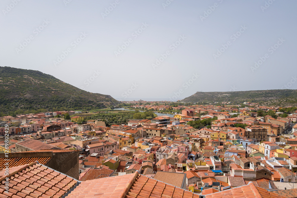 The view of the city rooftops in Bosa in Europe, Italy, Sardinia, Bosa, in summer, on a sunny day. The view of the city rooftops in Bosa in Europe, Italy, Sardinia, Bosa, in summer, on a sunny day.