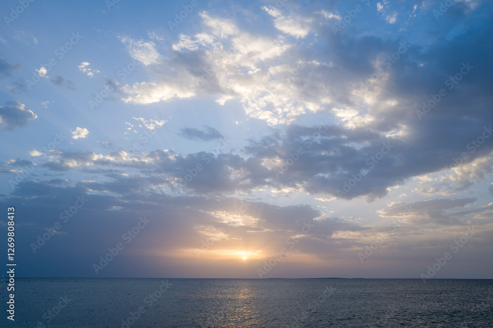 Sunset over the sea towards Oristano in Europe, Italy, Sardinia, Oristano, in summer, on a sunny day. Sunset over the sea towards Oristano in Europe, Italy, Sardinia, Oristano, in summer, on a sunny day.