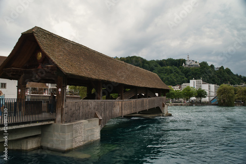 Photograph of the Spreuer Bridge (Spreuerbrucke, formerly also Muhlenbrucke) is one of the two surviving wooden covered walkways in the city of Lucerne Switzerland.

 photo