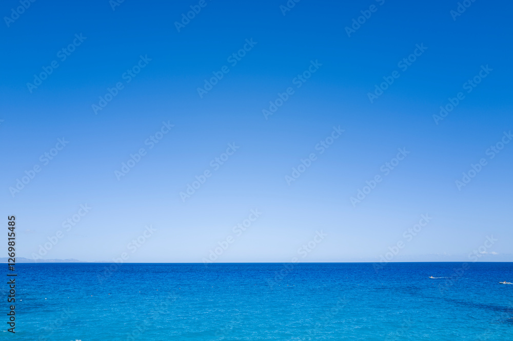 The sea in front of Cala Goloritze beach in Baunei in Europe, Italy, Sardinia, Baunei, in summer, on a sunny day. The sea in front of Cala Goloritze beach in Baunei in Europe, Italy, Sardinia, Baunei, in summer, on a sunny day.