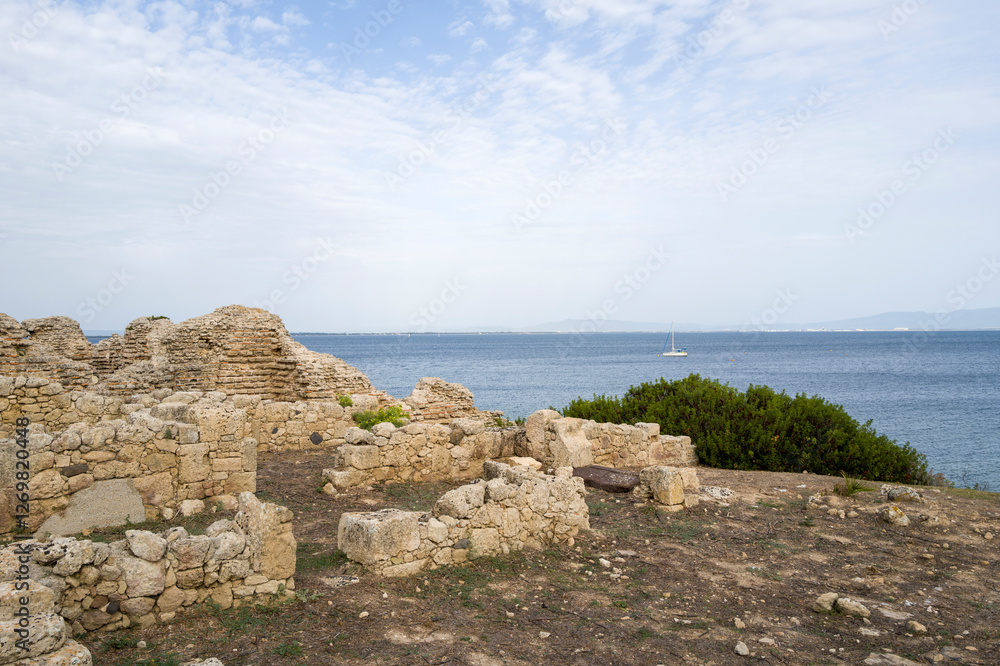 The archaeological site of Tharros in Cabras in Europe, Italy, Sardinia, Cabras, in summer, on a sunny day. The archaeological site of Tharros in Cabras in Europe, Italy, Sardinia, Cabras, in summer, on a sunny day.
