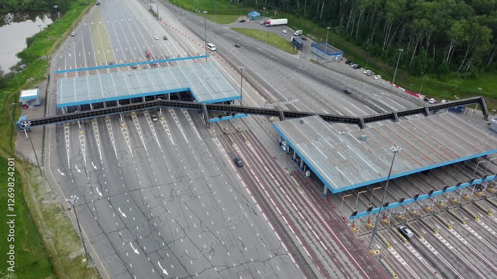 Moscow March 20 2023. Toll collection point on a toll road.. Cars on the way to the point: A stream of cars is approaching the payment point, lining up in front of the barriers Moscow March 20 2023. Toll collection point on a toll road.. Cars on the way to the point: A stream of cars is approaching the payment point, lining up in front of the barriers