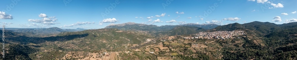 Fototapeta premium The panoramic view of the city in Orgosolo in Europe, Italy, Sardinia, Orgosolo, in summer, on a sunny day.