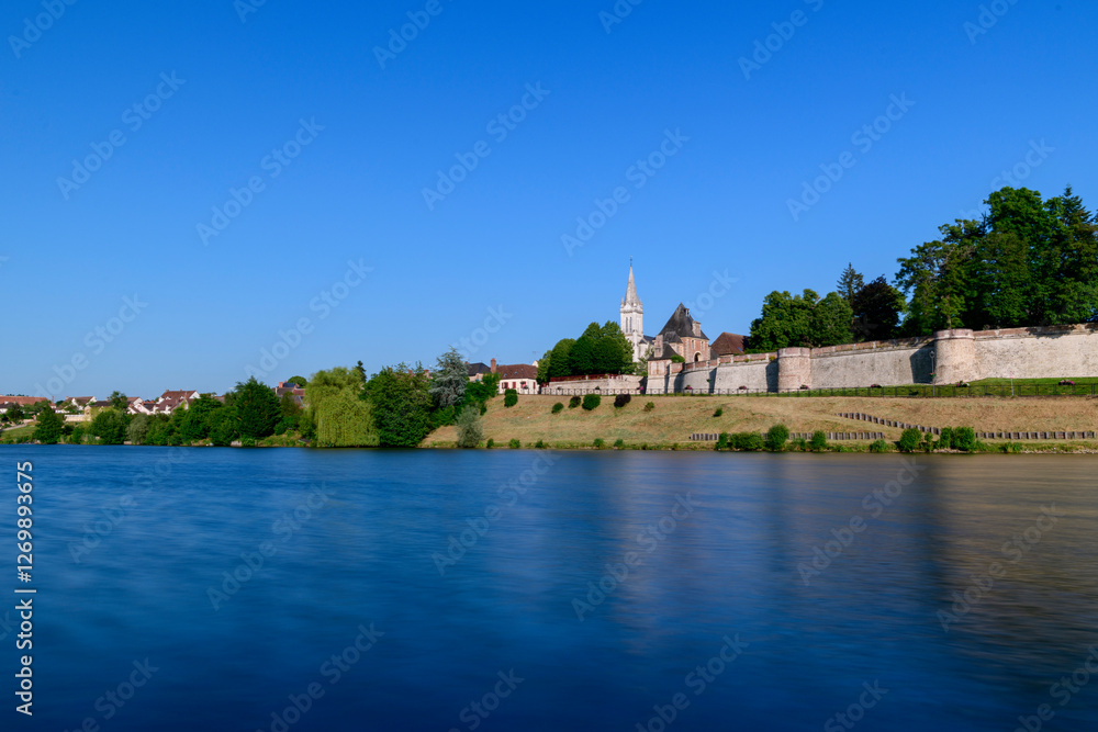 Obraz premium Dampierre-en-Burly view from the pond in Europe, France, Centre Val de Loire, Loiret, Dampierre en Burly, in summer, on a sunny day.