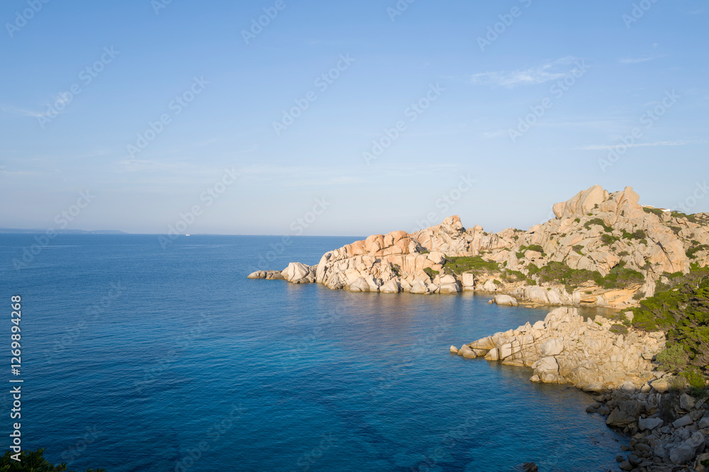 The rocks on the Mediterranean Sea shore at Capo Testa in Europe, Italy, Sardinia, Capo Testa, in summer, on a sunny day. The rocks on the Mediterranean Sea shore at Capo Testa in Europe, Italy, Sardinia, Capo Testa, in summer, on a sunny day.