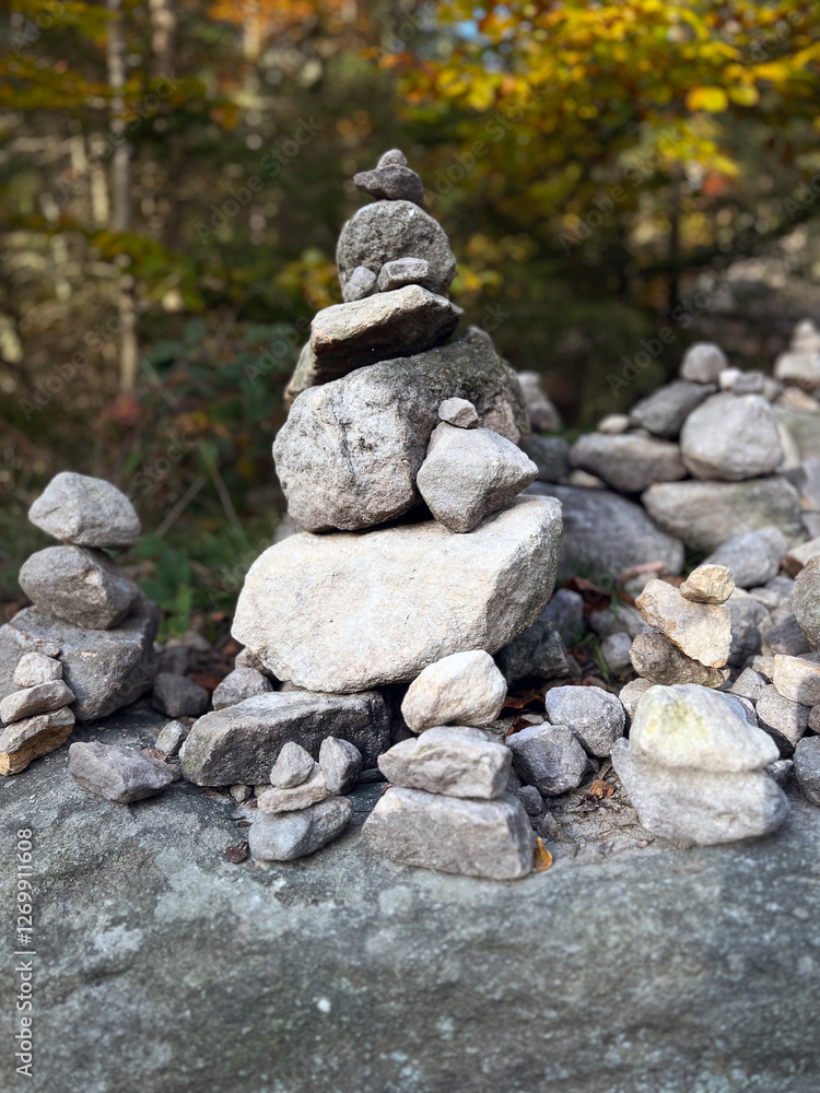 A carefully stacked stone cairn in a peaceful forest setting, symbolizing balance, mindfulness, and meditation. A perfect nature-inspired image for wellness, travel, and outdoor adventure themes A carefully stacked stone cairn in a peaceful forest setting, symbolizing balance, mindfulness, and meditation. A perfect nature-inspired image for wellness, travel, and outdoor adventure themes