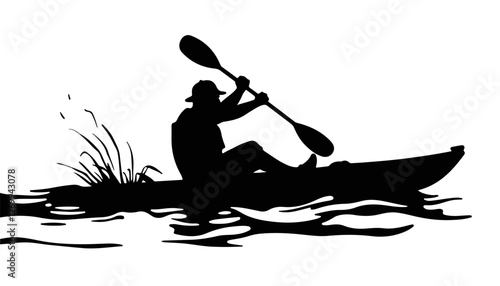 Silhouette of a kayaker paddling on calm water